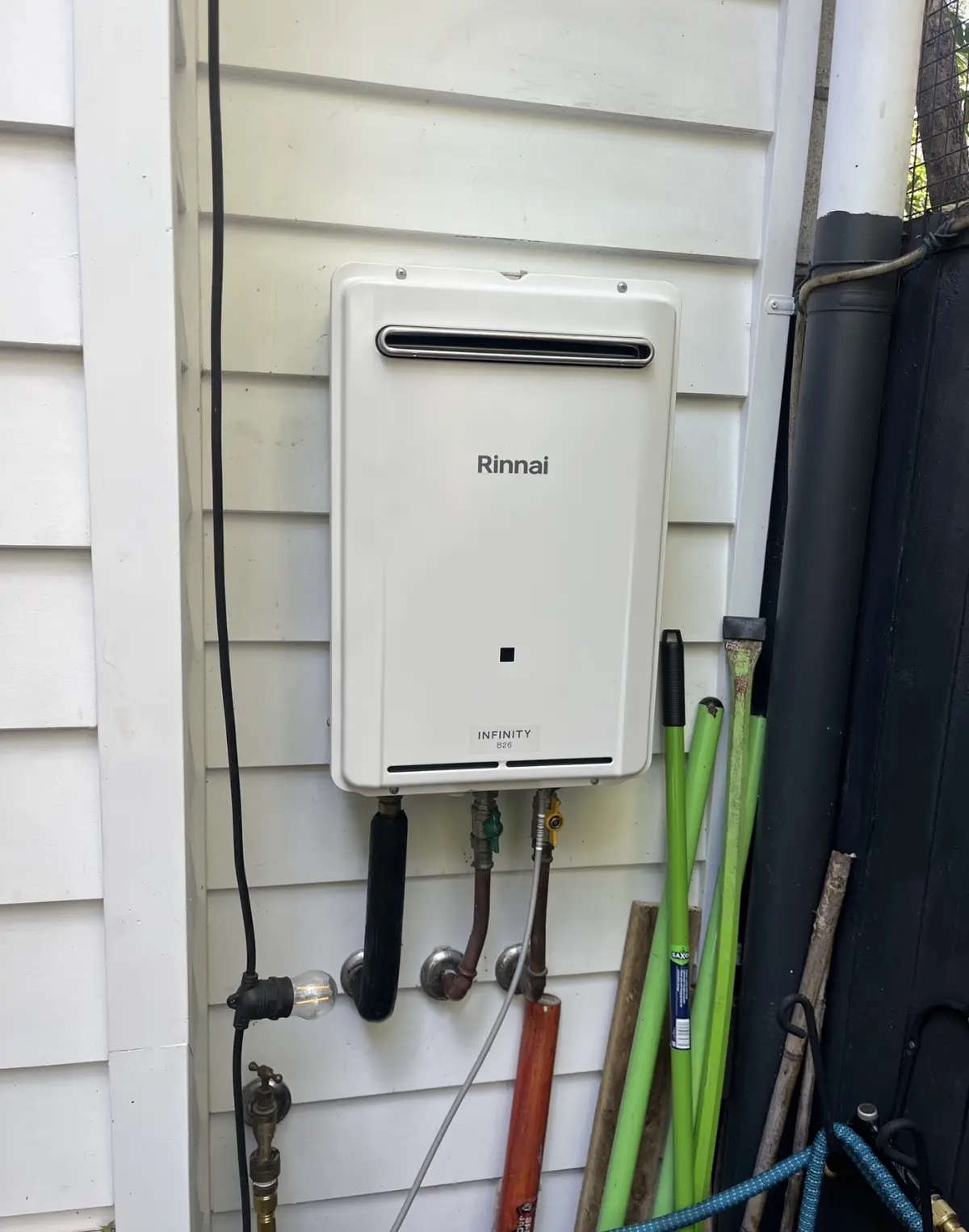 Rinnai Infinity gas hot water system reassembled after professional servicing in Brisbane