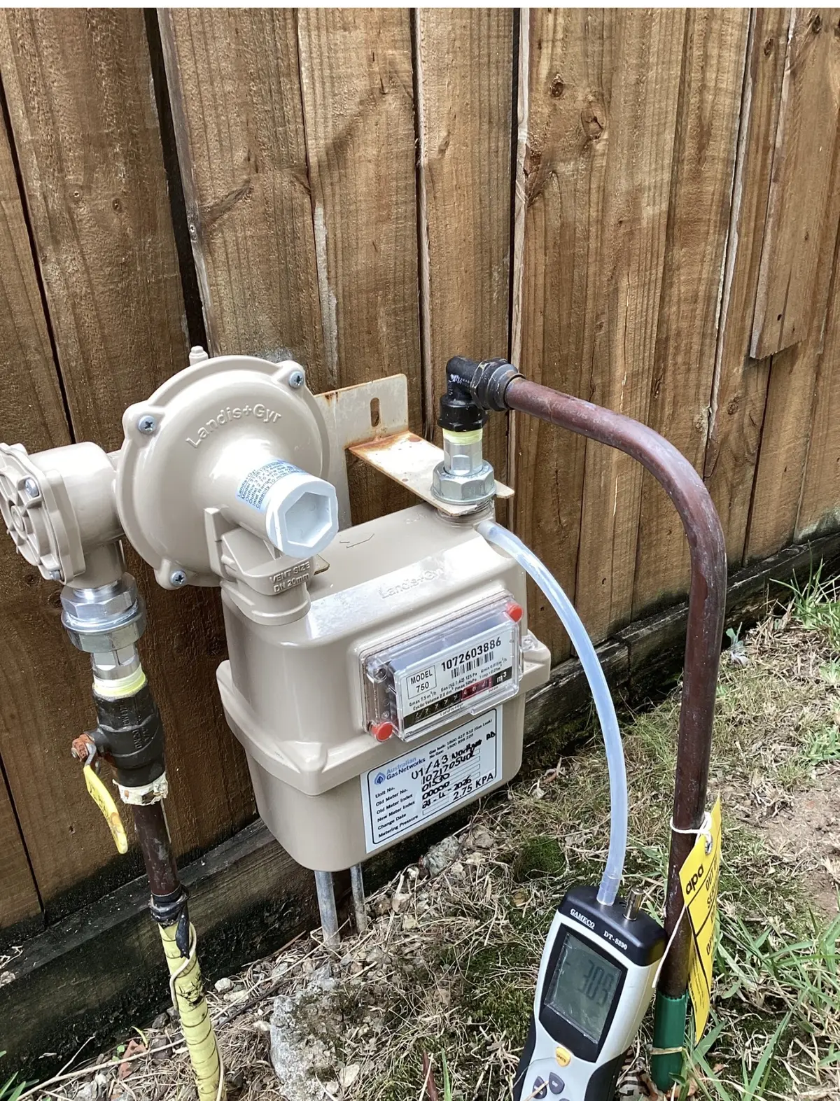 Gas pressure testing at a Brisbane property gas meter using a digital manometer